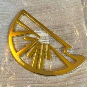 Lilly Pulitzer gold bottle opener.